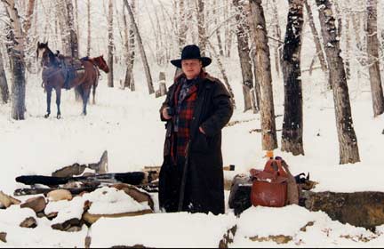 Brian Lyttle by the Highwood River, Longview, Alberta, Canada, with his horse "Sky"--enjoying a cup of coffee.