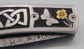 Brian Lyttle Custom Knifemaker: Engraved Damascus Celtic Liner Lock Folding Knife--Closeup of bolsters (side 2)