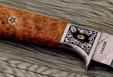 Brian Lyttle Custom Knifemaker: Closeup of engraving on Damascus hunting knife 